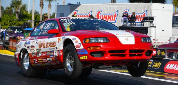 1998 red Dodge Avenger at the staring line