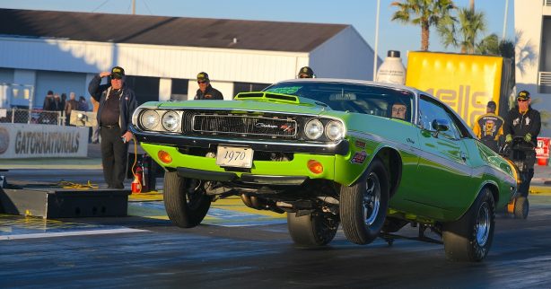 1970 green Challenger R/T pops wheelie while taking off