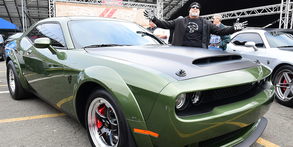 Bill Goldberg standing beside his F8 green Demon