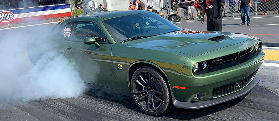 Goldberg doing a burnout in a F8 green 1320 Drag Pack