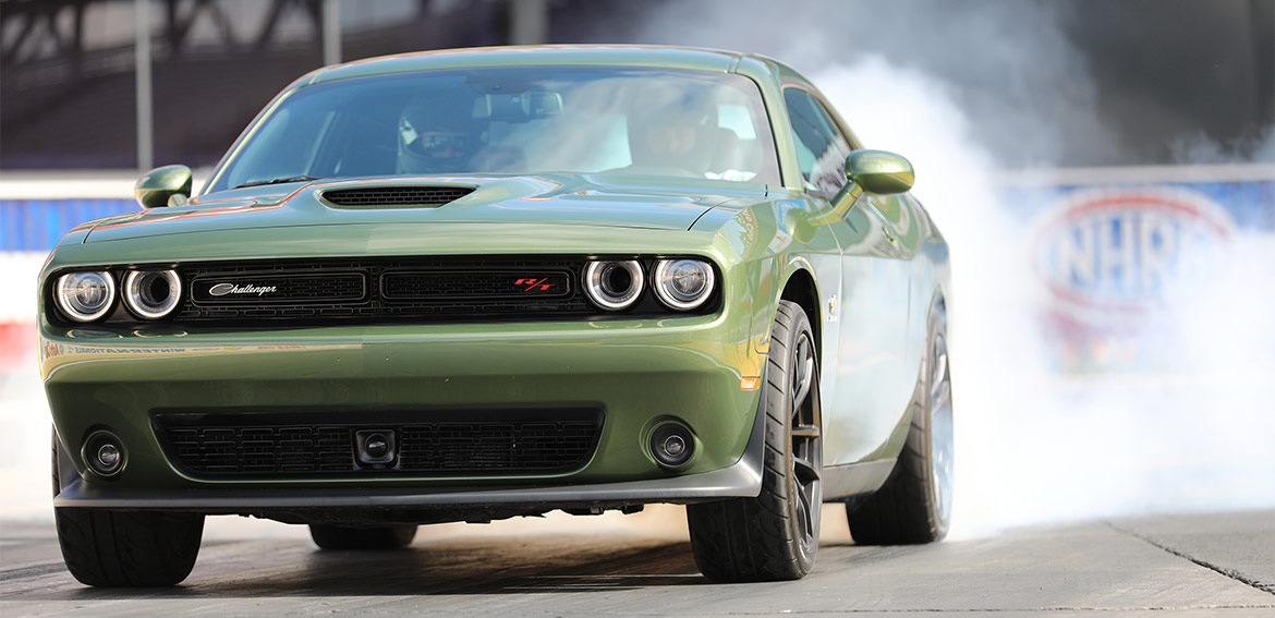 F8 Green 1320 Challenger Drag Pak launching off the start line on the drag strip