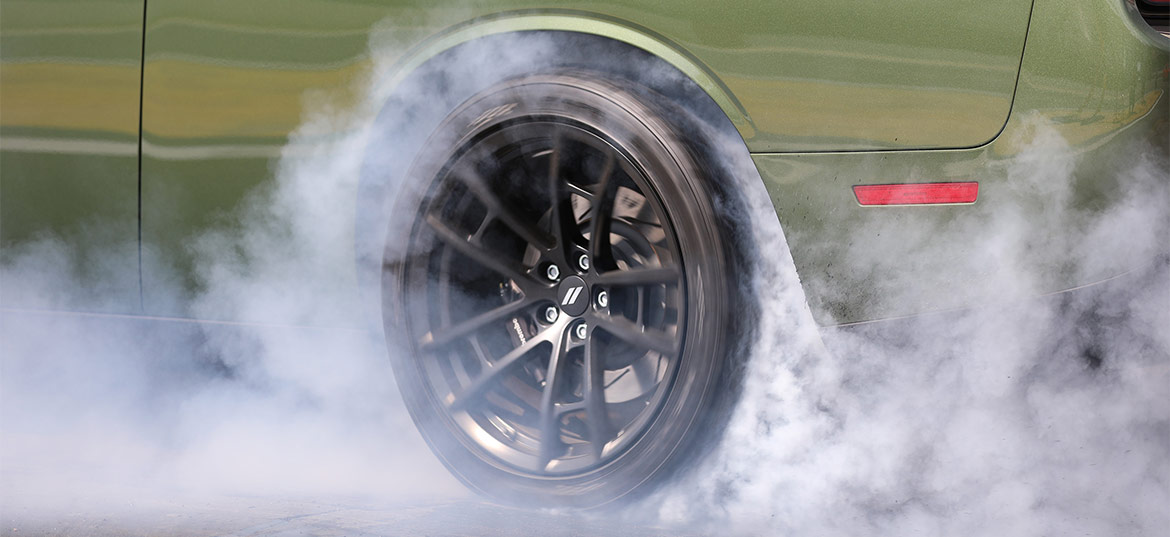 F8 Green 1320 Challenger Drag Pak wheel with smoke from burnout