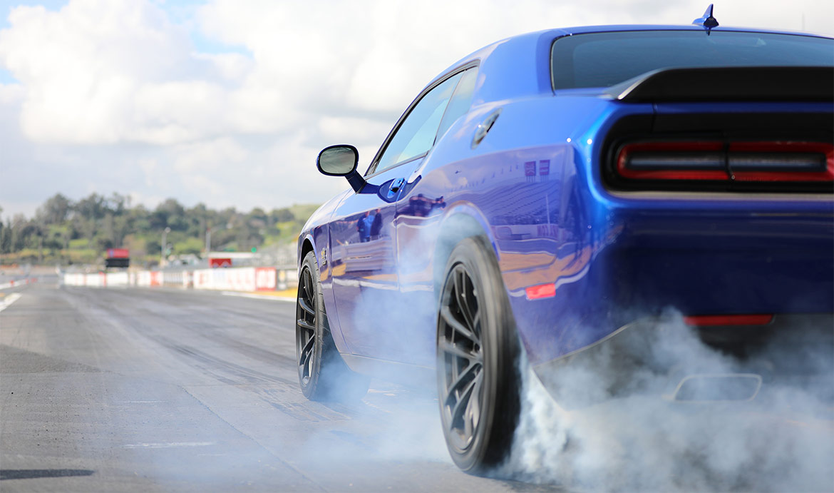 Blue 1320 Drag Pak doing a burnout on the track