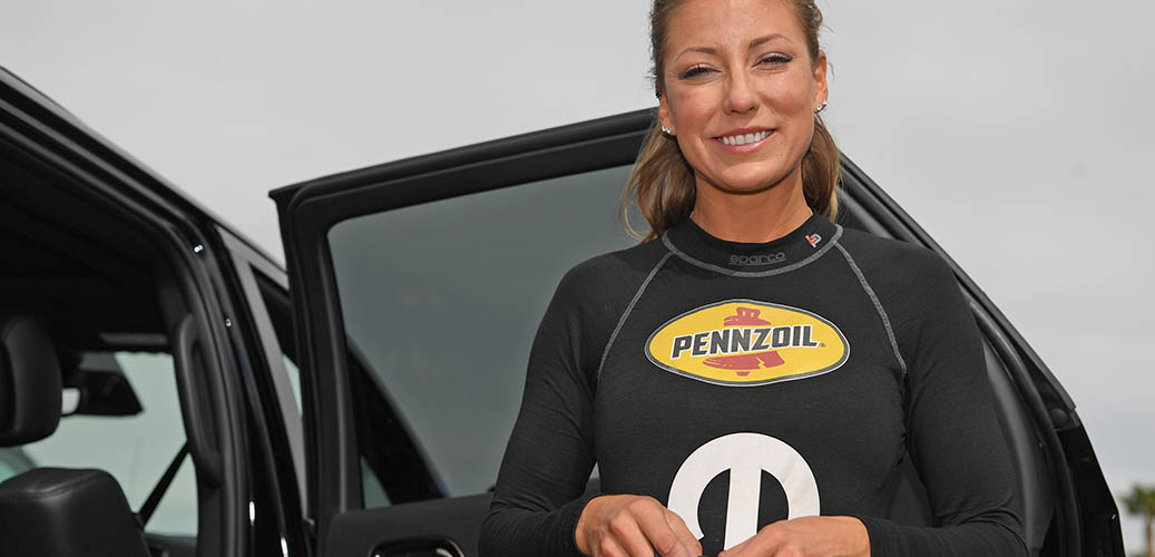 Leah Pritchett sanding outside of her Durango SRT