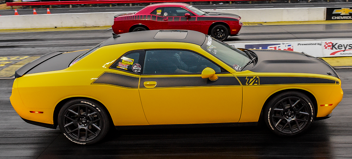 Yellow Challenger TA racing a red Challenger TA