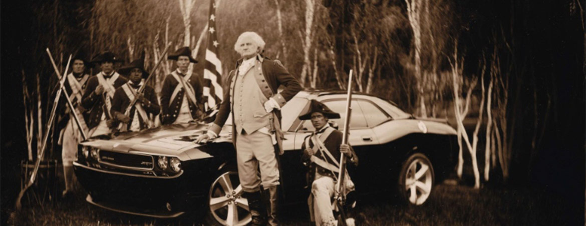 George Washington and his soldiers standing next to a Dodge Challenger