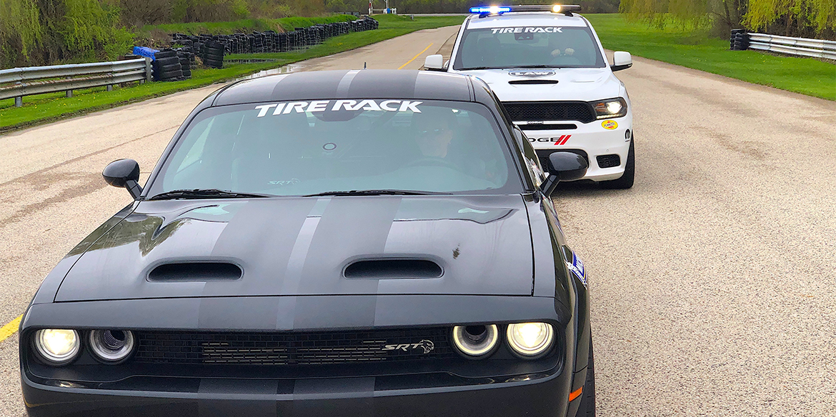 One Lap of America Durango SRT Pursuit pulling over a black SRT Hellcat Redeye being driven by Mike Musto