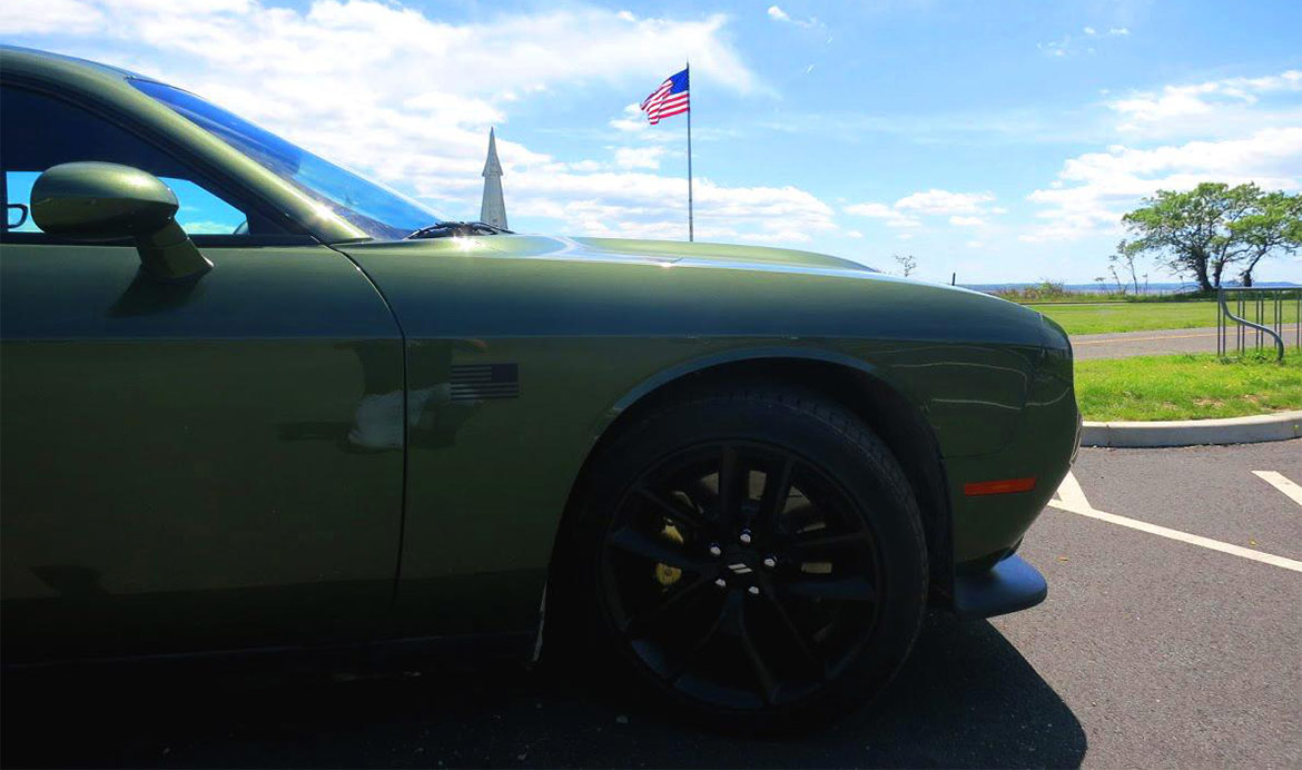 Dodge Challenger Stars & Stripes edition with American flag in the background