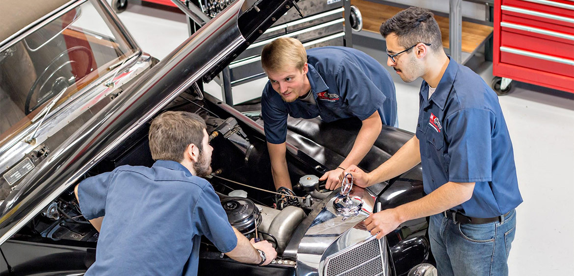 Under the hood of the Mercedes-Benz 300 S Cabriolet that the students are restoring to compete at Pebble Beach in 2023