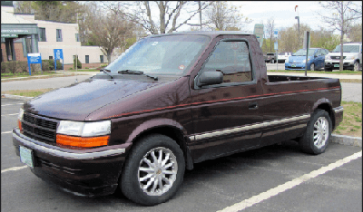 a dodge caravan minivan turned into a pickup 