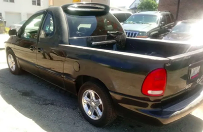 a dodge caravan turned into a cargo hauler