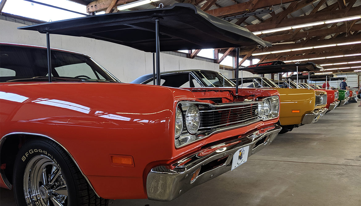 Row of classic cars at Mopars in the Park