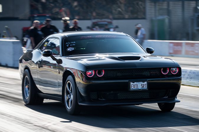 dodge vehicle on the starting line of a drag strip