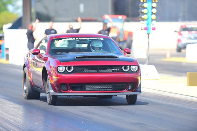 dodge vehicle on the starting line of a drag strip