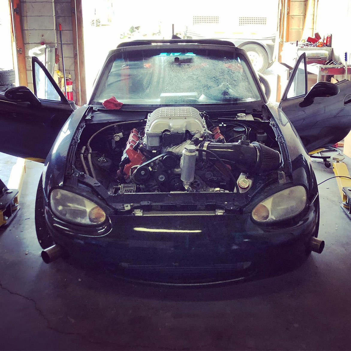 a car being worked on in a garage