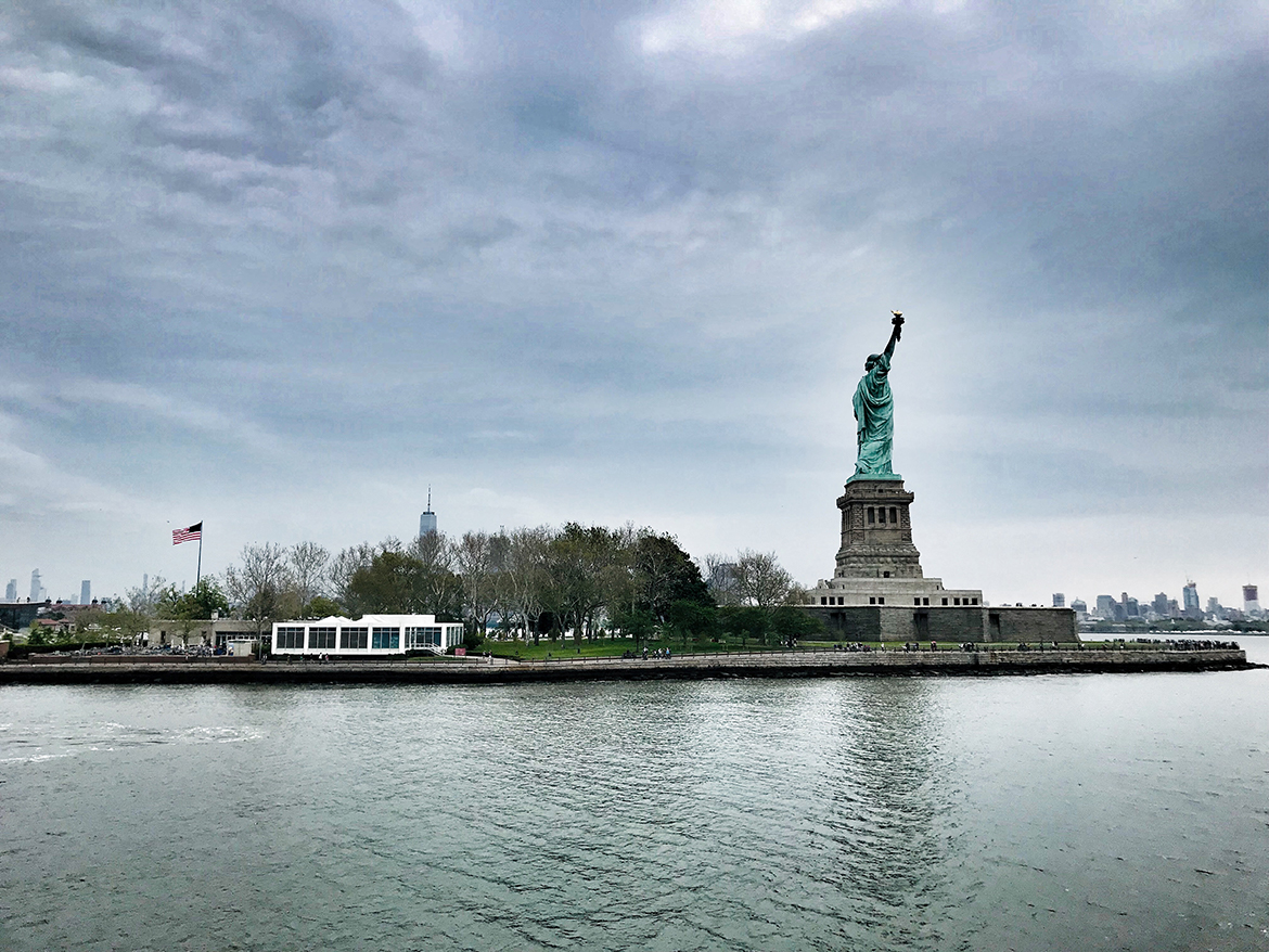 a view of liberty island from the hudson river