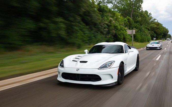 Two Dodge Viper ACR-e vehicles driving down the road