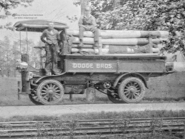 Dodge truck transporting 155mm barrels