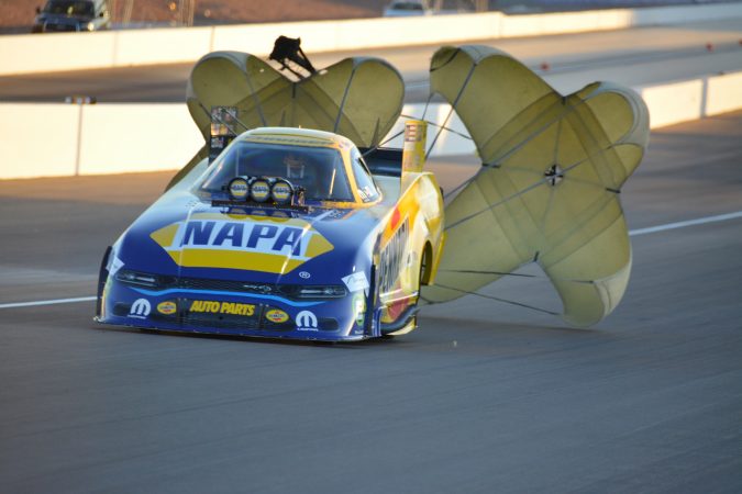 parachutes coming out of a funny car
