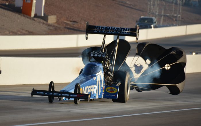 parachutes coming out of a top fuel dragster