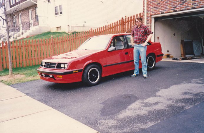 Man standing next to Shelby Lancer