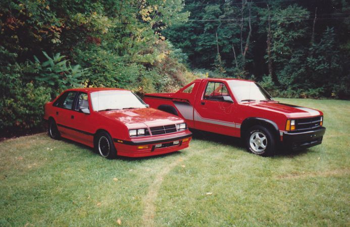 Shelby Lancer next to Dodge truck
