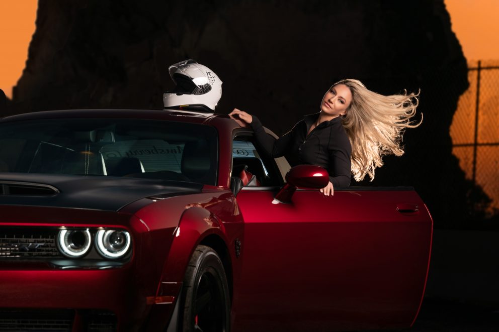 woman with a dodge challenger
