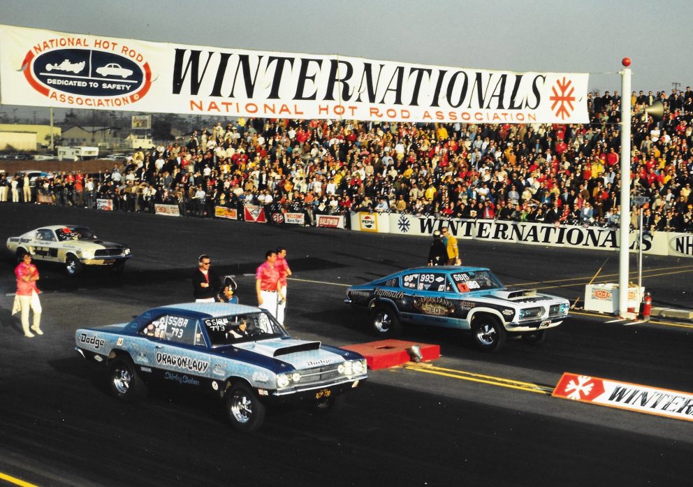 two vehicles on a drag strip