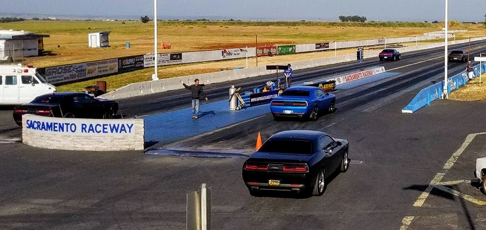 vehicles in the staging lane of a drag strip