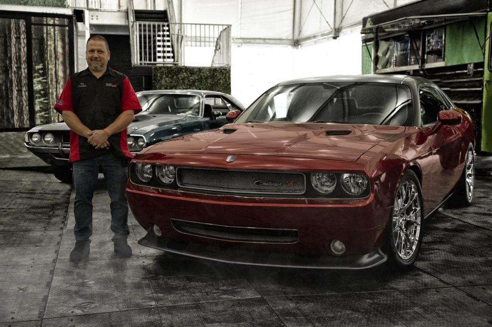 man standing beside his Charger R/T