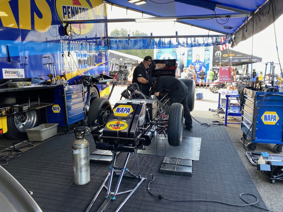 crew working on top fuel car
