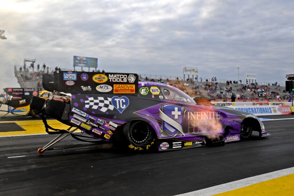 Jack Beckman racing his funny car down the track