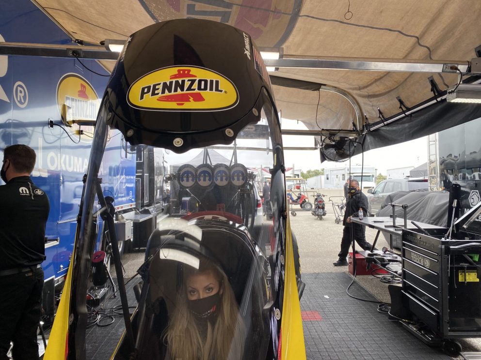 Leah sitting in her top fuel dragster