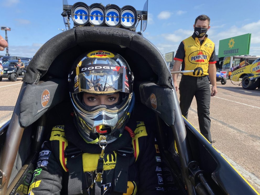 Leah Pruett sitting in her top fuel dragster getting ready to race