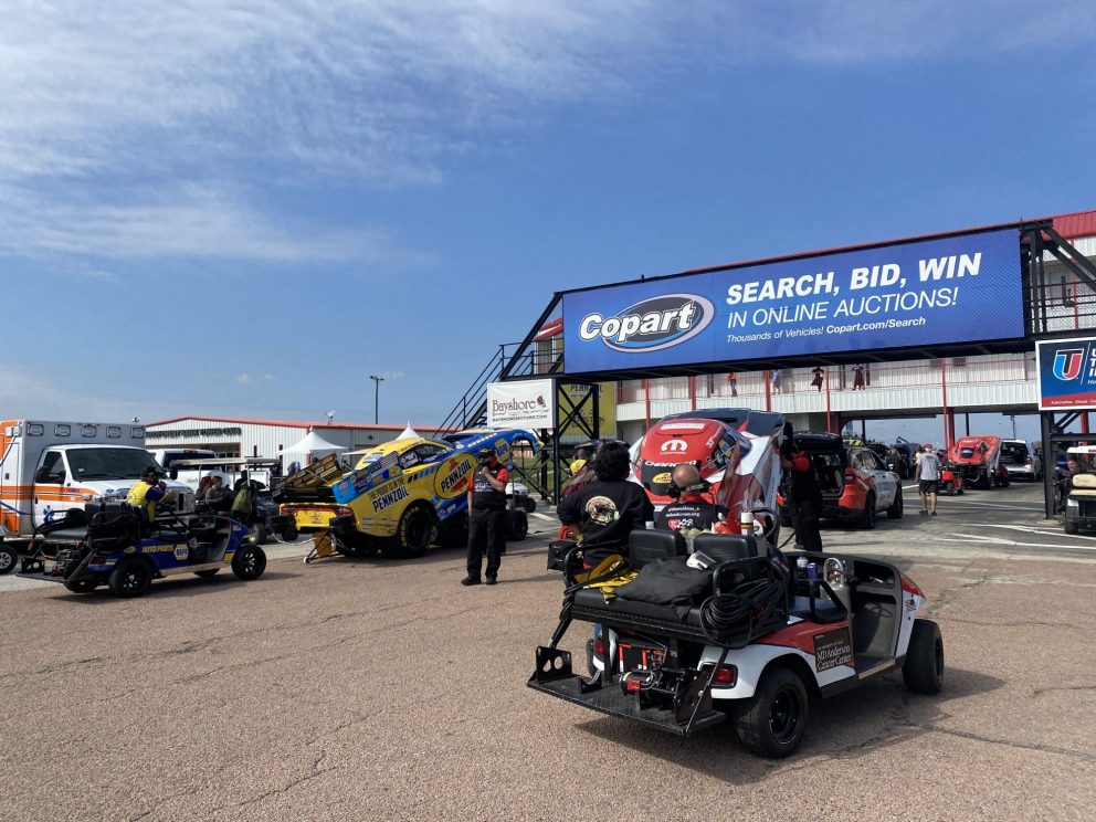 Ron Capps' crew getting his funny car ready to race