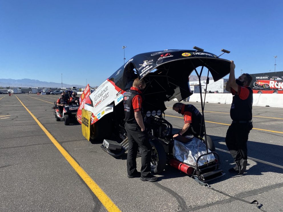 Tommy Johnson Jr.'s crew working on his funny car