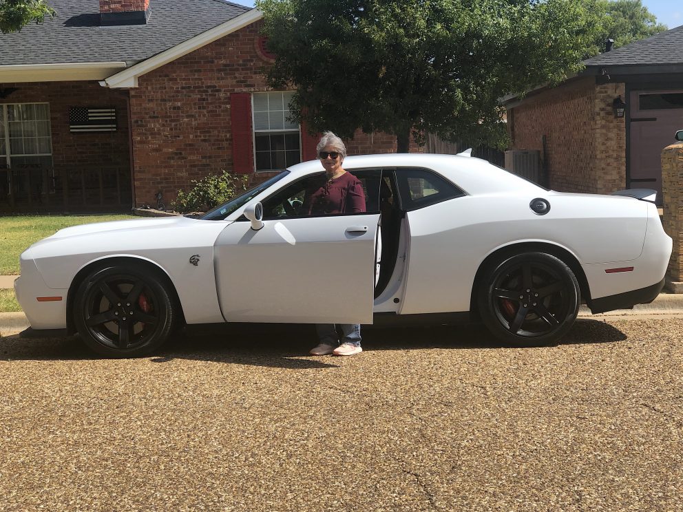 Carolyn posing with her new Hellcat