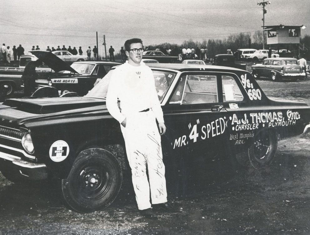 Herb standing next to his race car