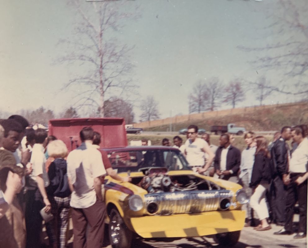 Fans gathering around Della Woods race car