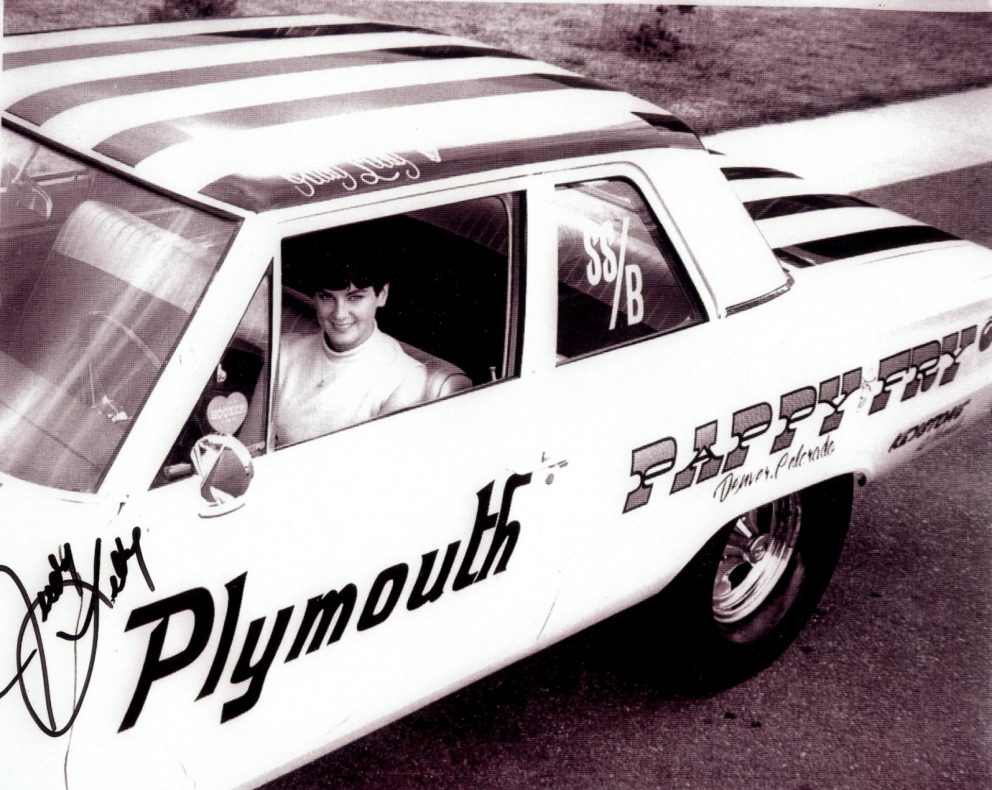 Judy Lilly sitting in her drag car