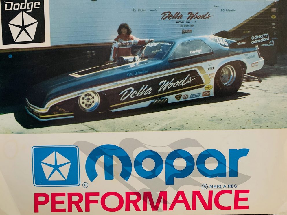 Della Woods standing next to her Funny Car