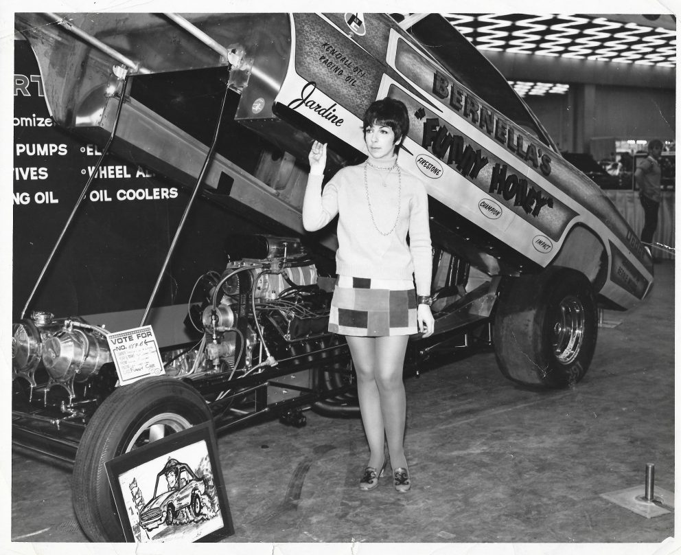 Della Woods posing with her Funny Car