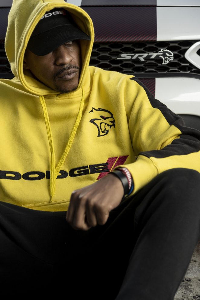 man sitting wearing a Dodge hoodie