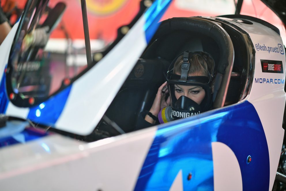 Leah Pruett sitting in her top fuel dragster