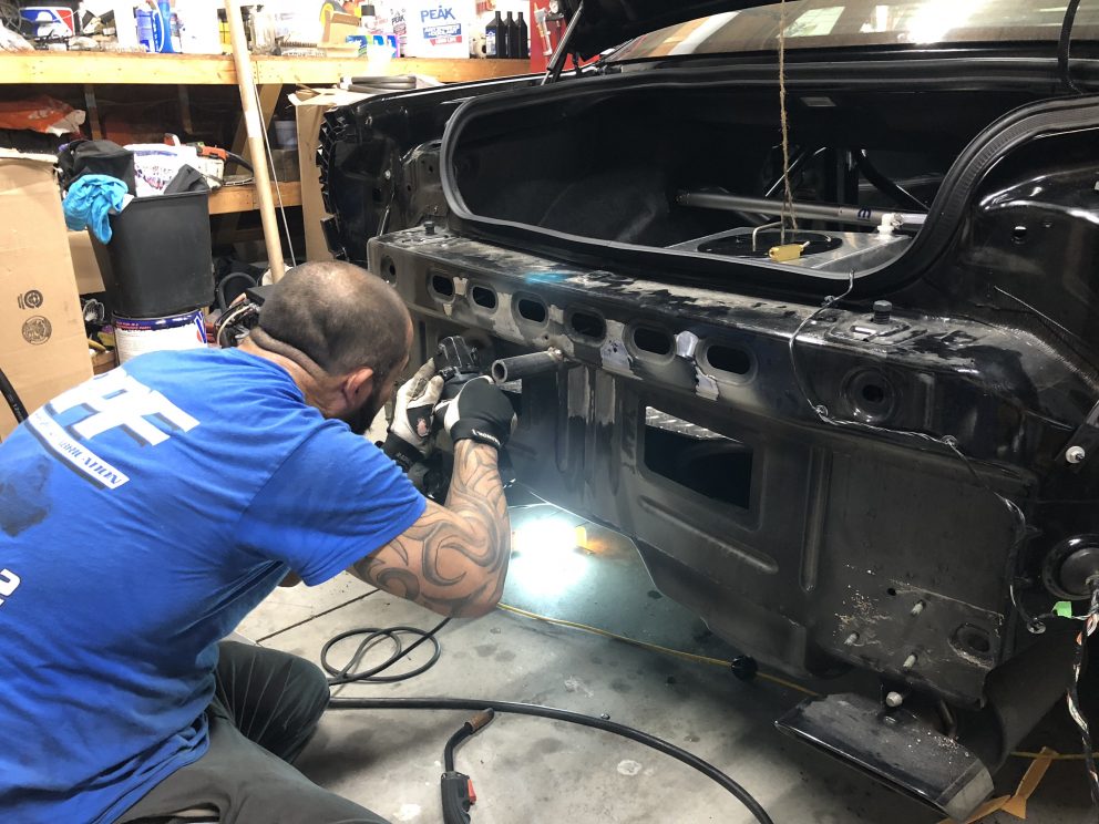 Man working on a Dodge Challenger