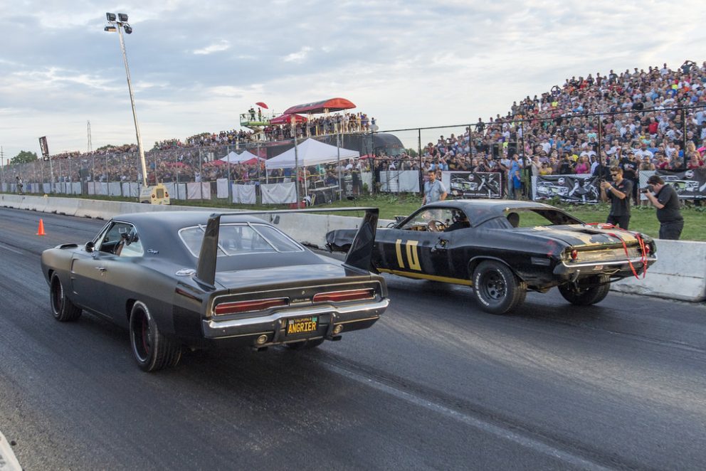 Vehicles on the starting line of a drag strip 