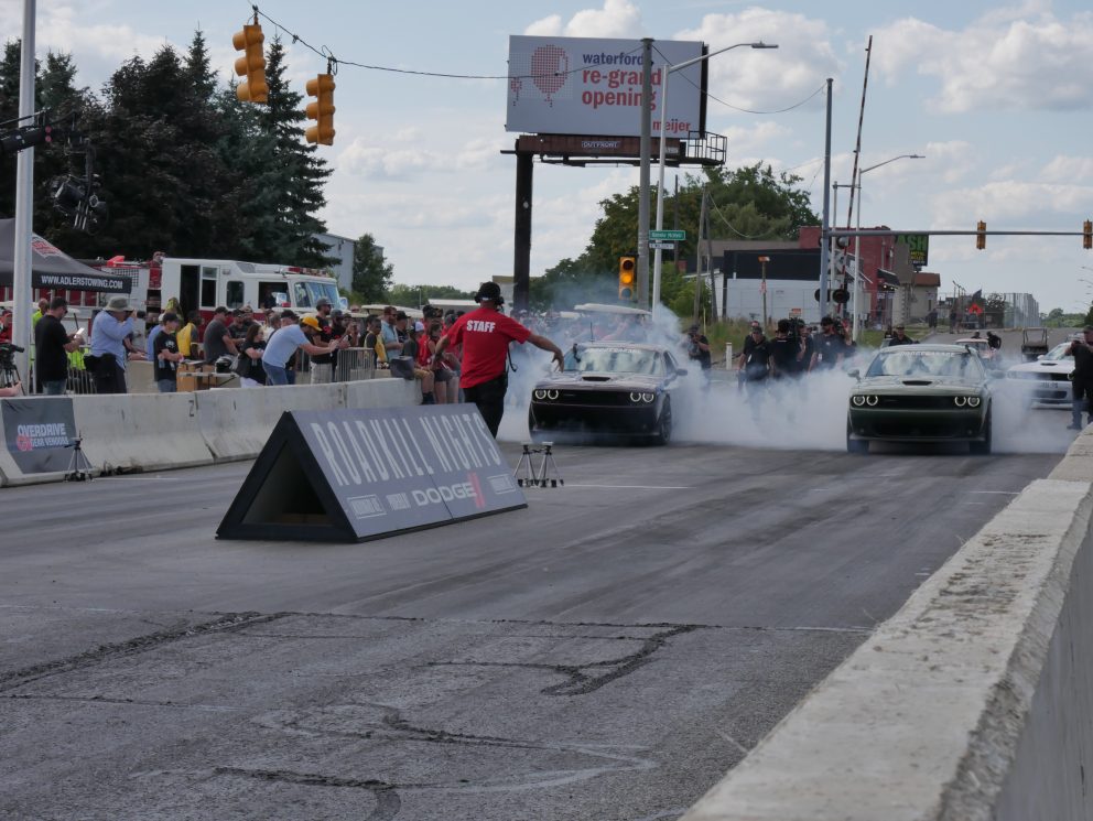 Vehicles on the starting line of a drag strip 