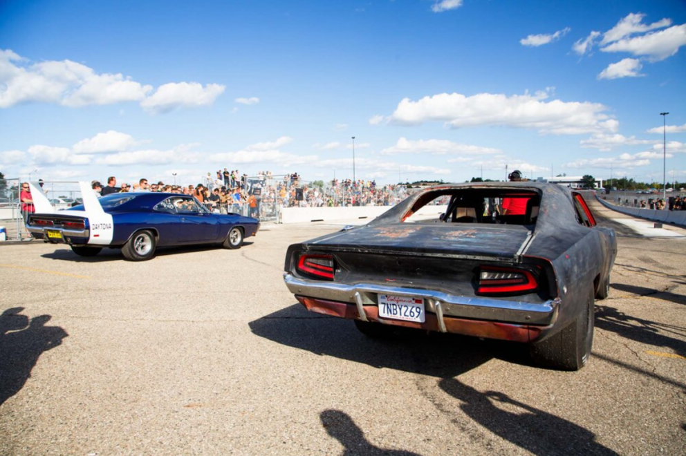 two cars getting ready to drag race at Roadkill Nights Powered by Dodge