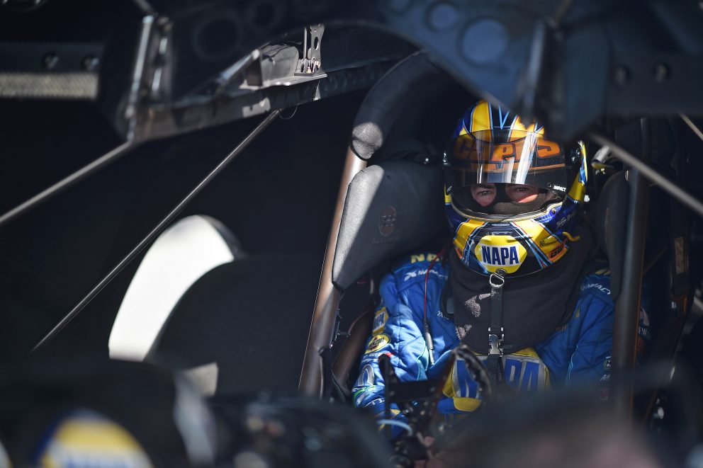 Ron Capps sitting in his funny car getting ready to race