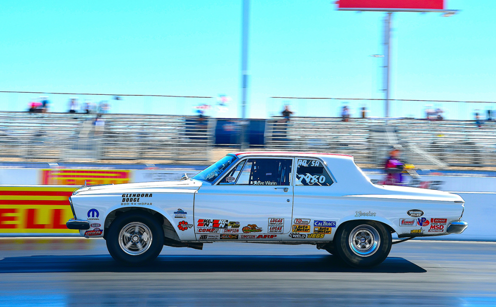 Vehicle racing down a drag strip